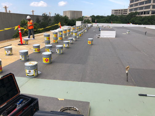 PVC roof membrane flashed around restaurant kitchen exhaust equipment